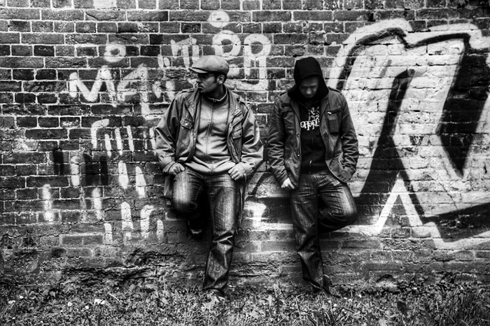 Leaning against the wall...