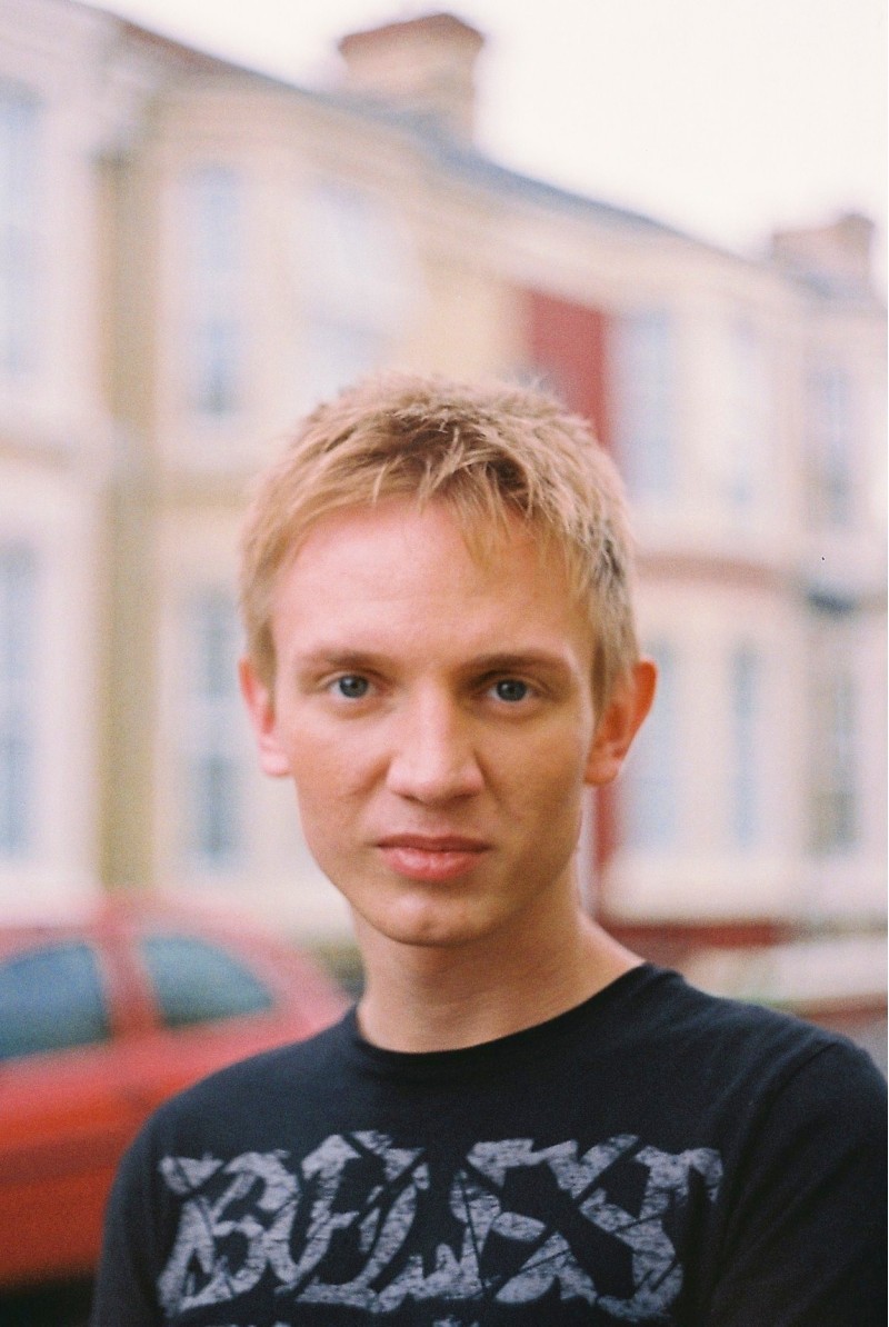 J.